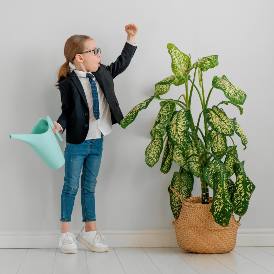 child growing a plant